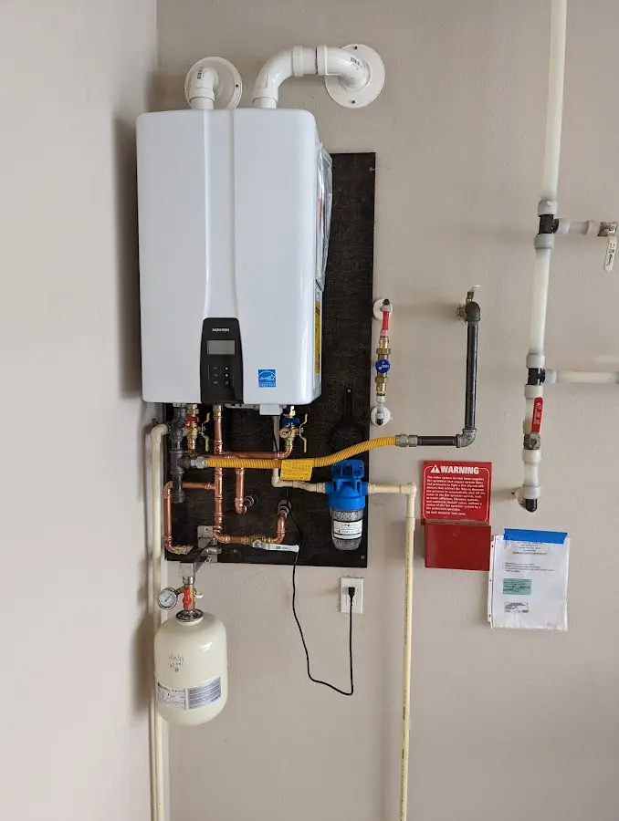 Professional plumber installing copper piping in a Salisbury home